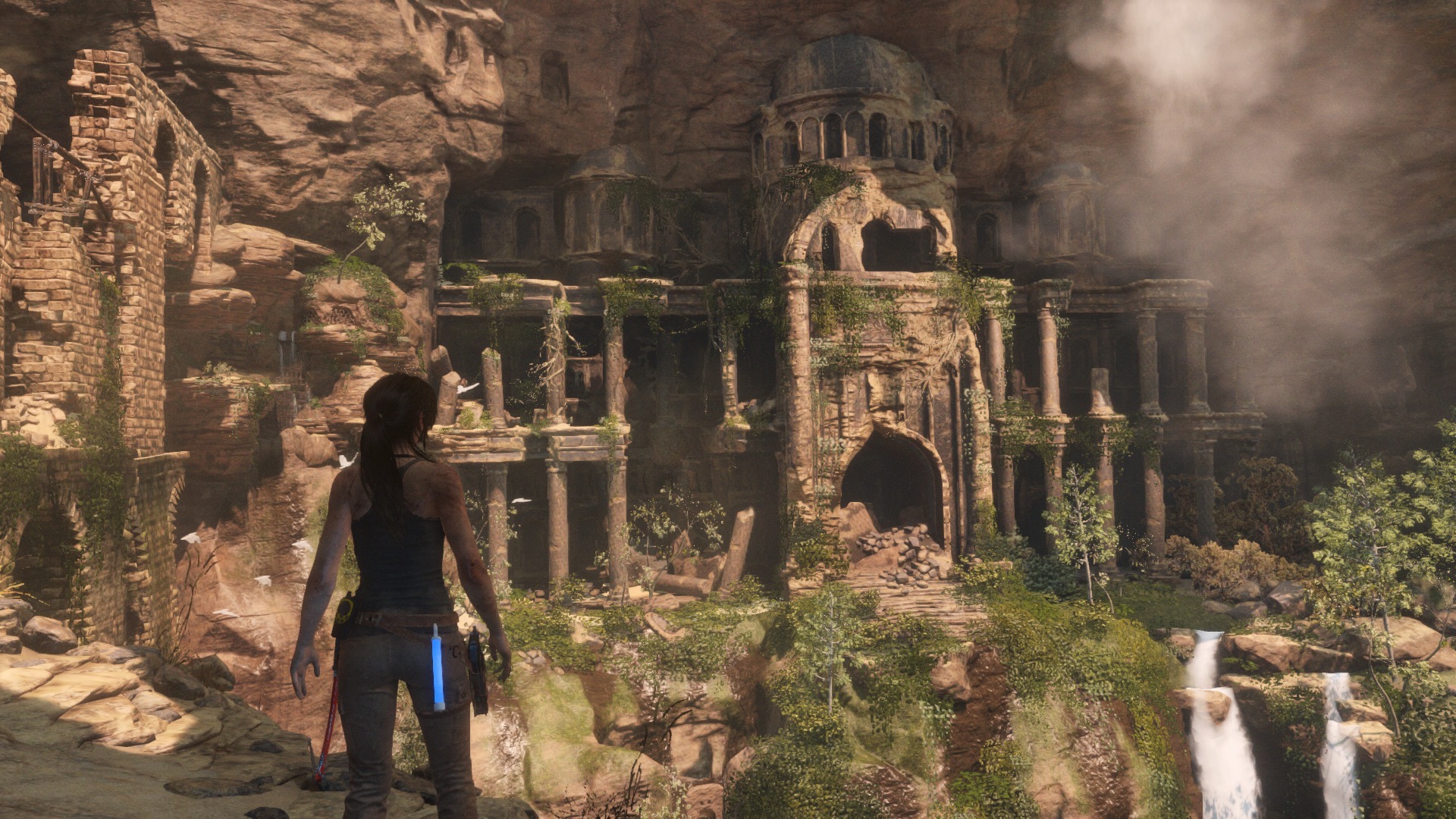 Lara looks over a horizontal tomb