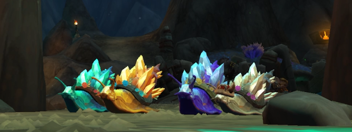 Four Warcraft snails racing around a track