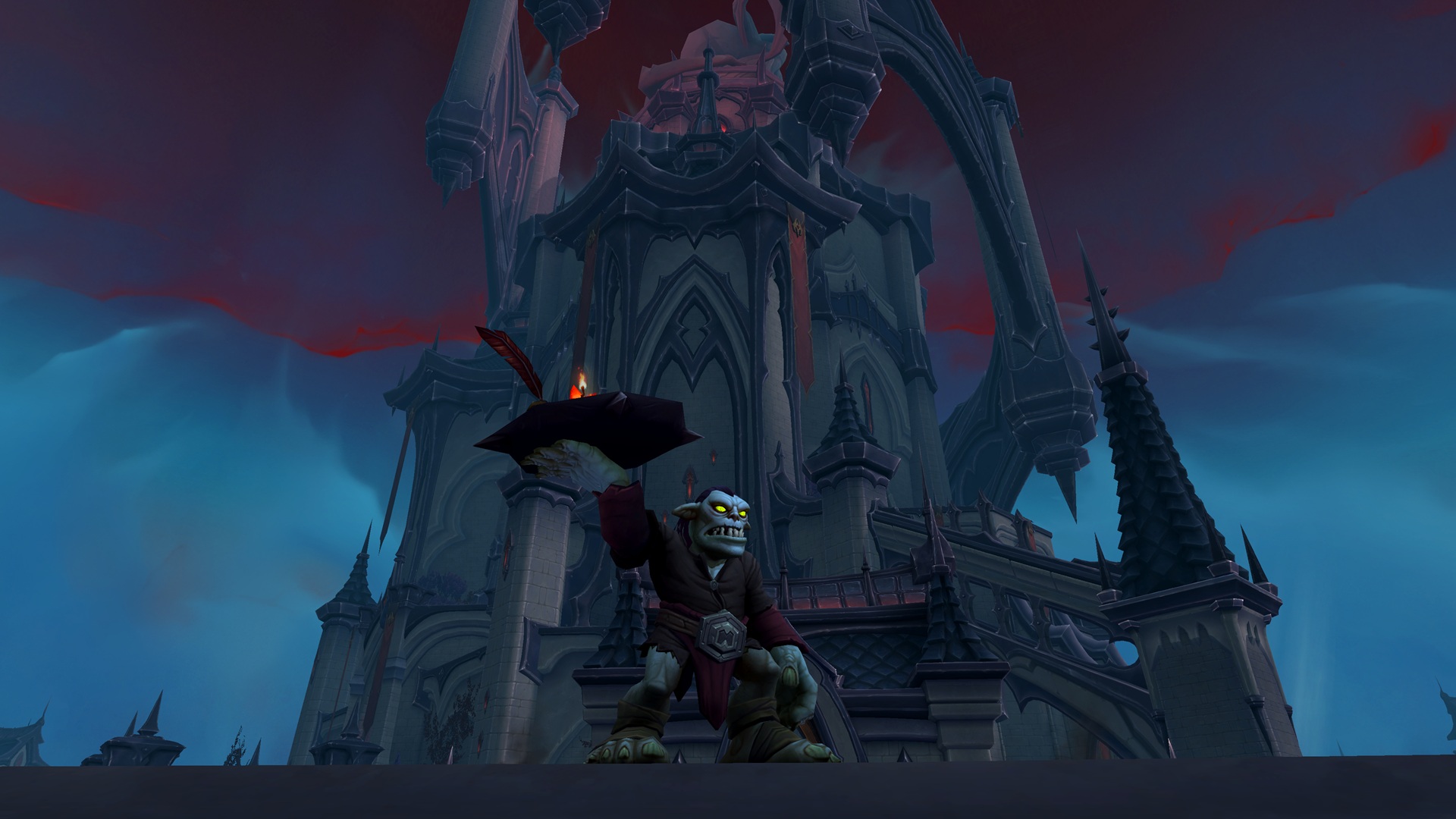 A goblin holds a tray of drinks in the foreground, whilst a castle towers over it in the background